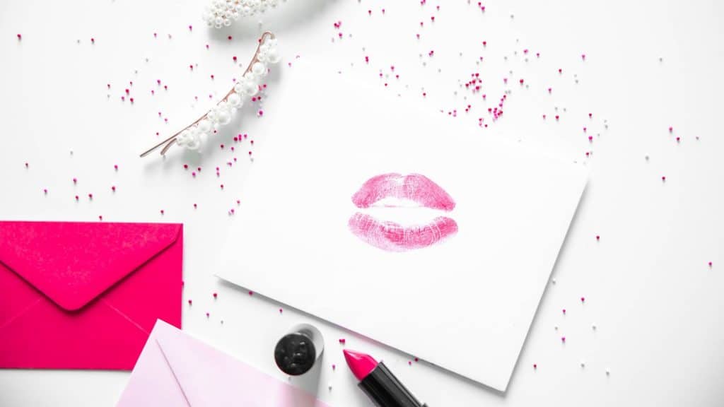 pink lip color kissed on envelope for valentines day